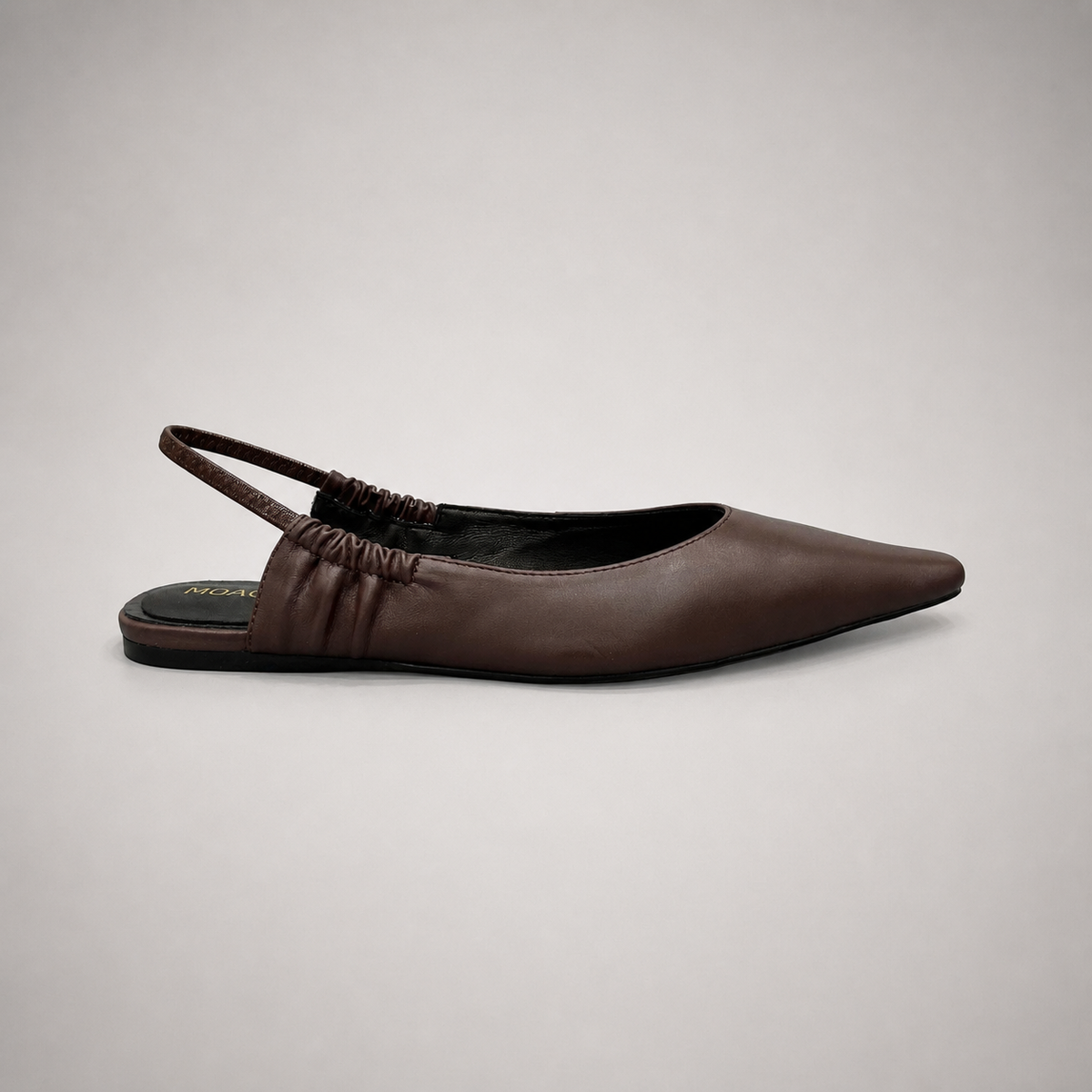 Brown slingback flat side profile showing a square toe and gathered slingback strap