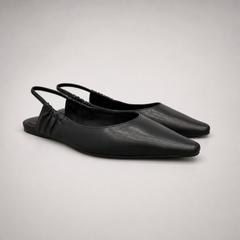 Black slingback flat pair three-quarter view showing a square toe and gathered slingback strap