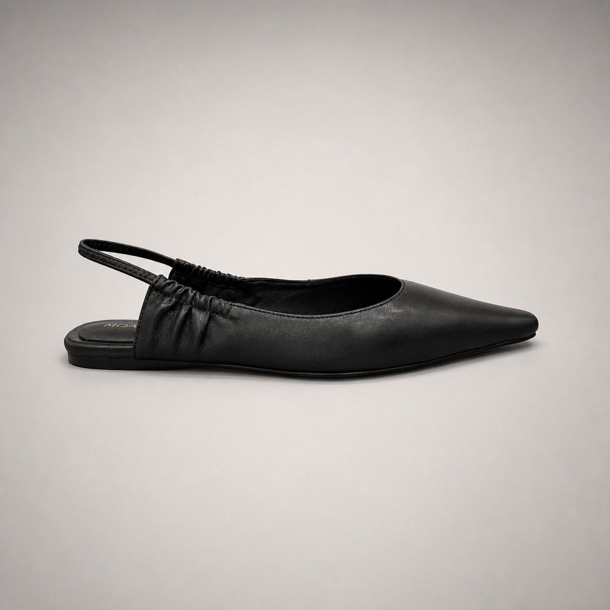 Black slingback flat side profile showing a square toe and gathered slingback strap