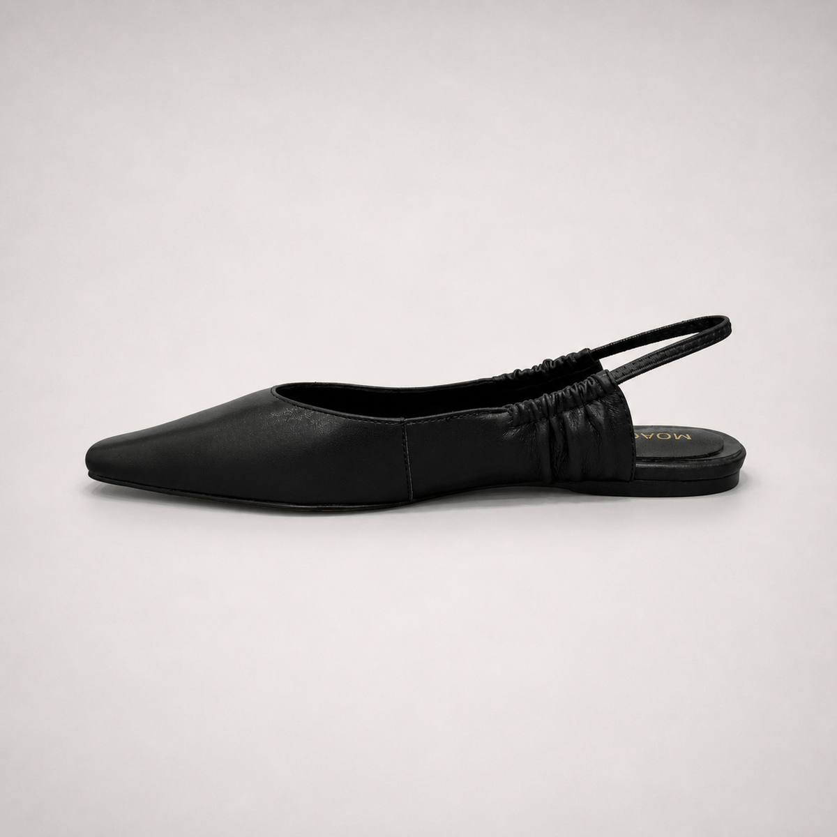 Black slingback flat opposite side profile showing a square toe and gathered slingback strap