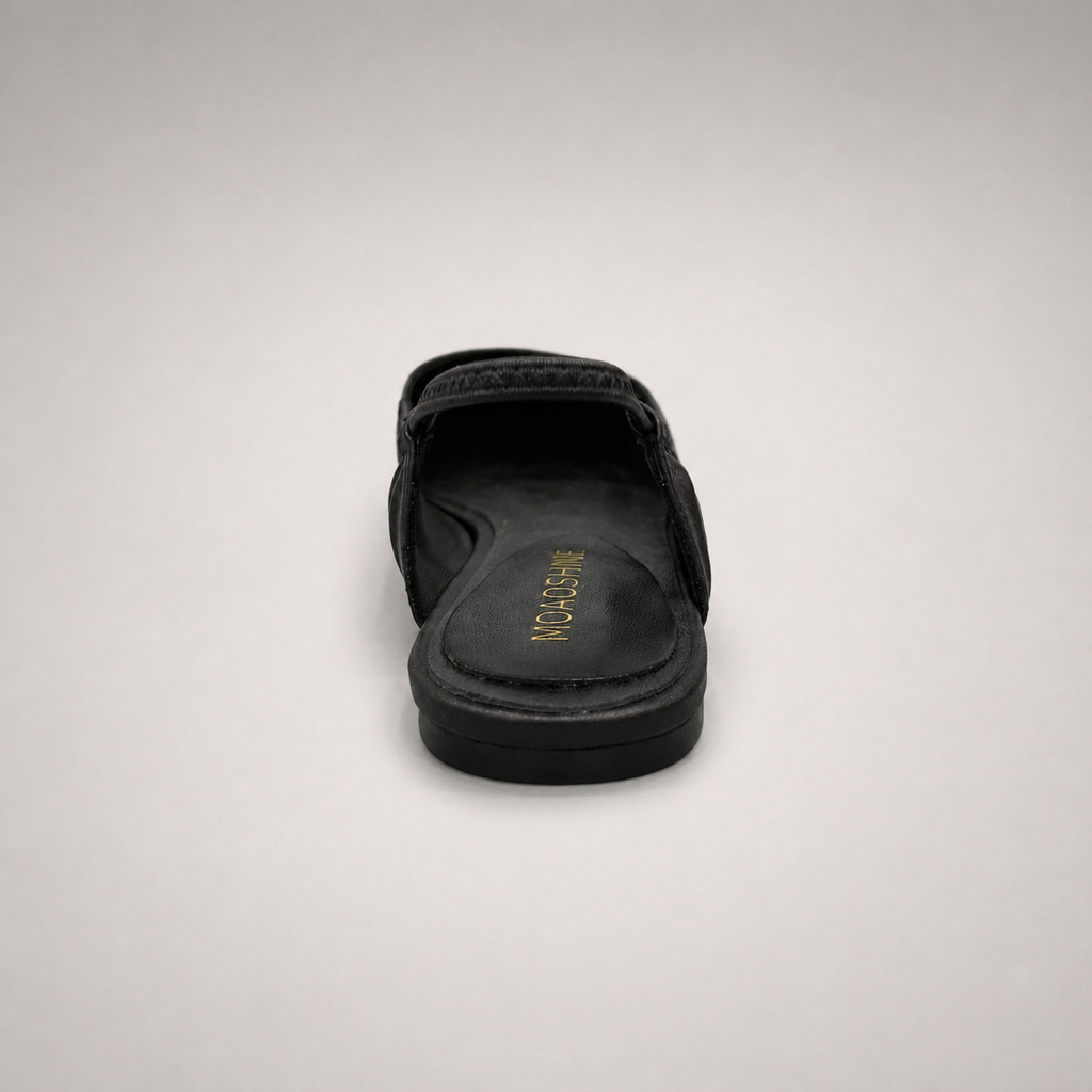 Black slingback flat rear view showing a square toe and gathered slingback strap