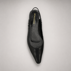 Black slingback flat outsole view showing the cow leather outsole
