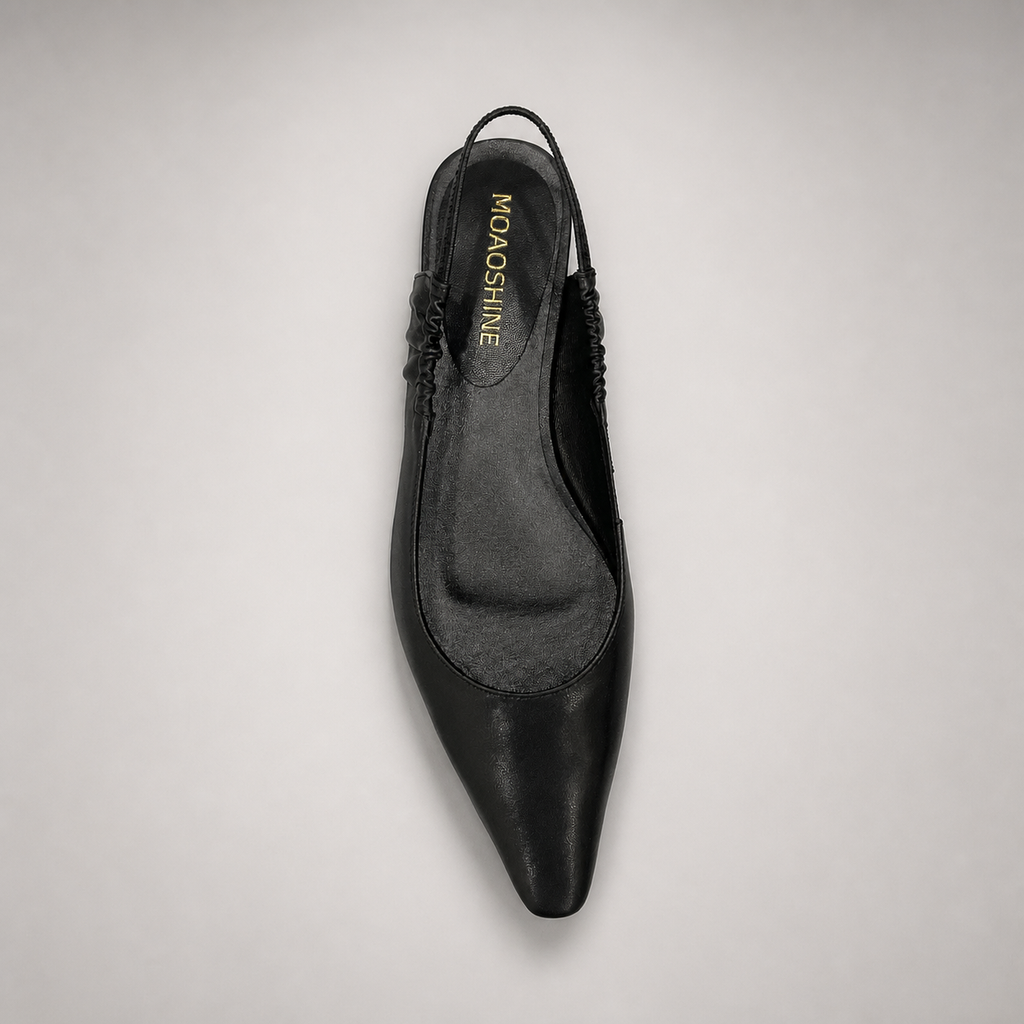 Black slingback flat outsole view showing the cow leather outsole