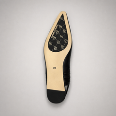 Black slingback flat top view showing a square toe and gathered slingback strap
