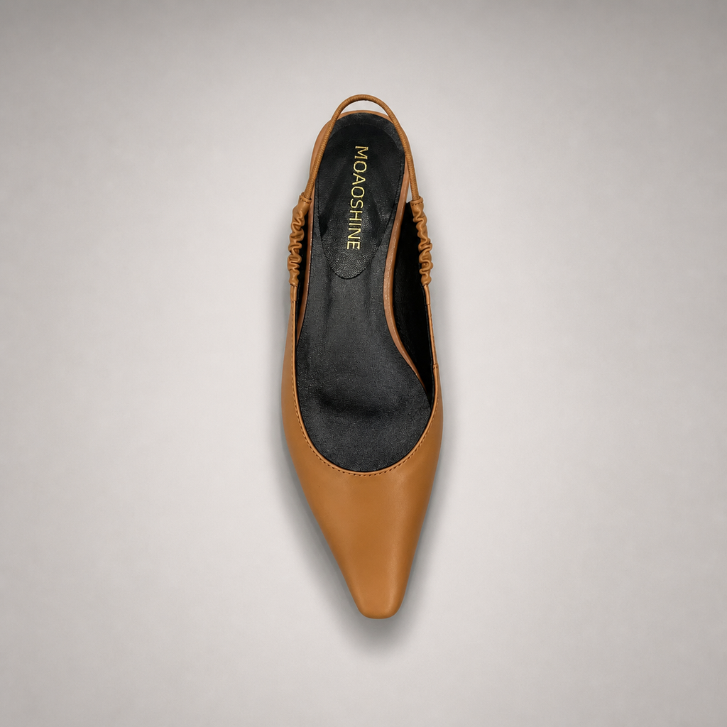 Tan slingback flat outsole view showing the cow leather outsole