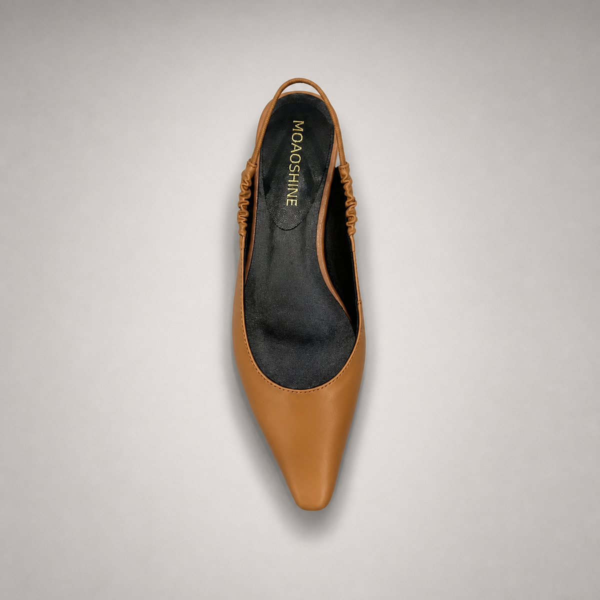 Tan slingback flat outsole view showing the cow leather outsole