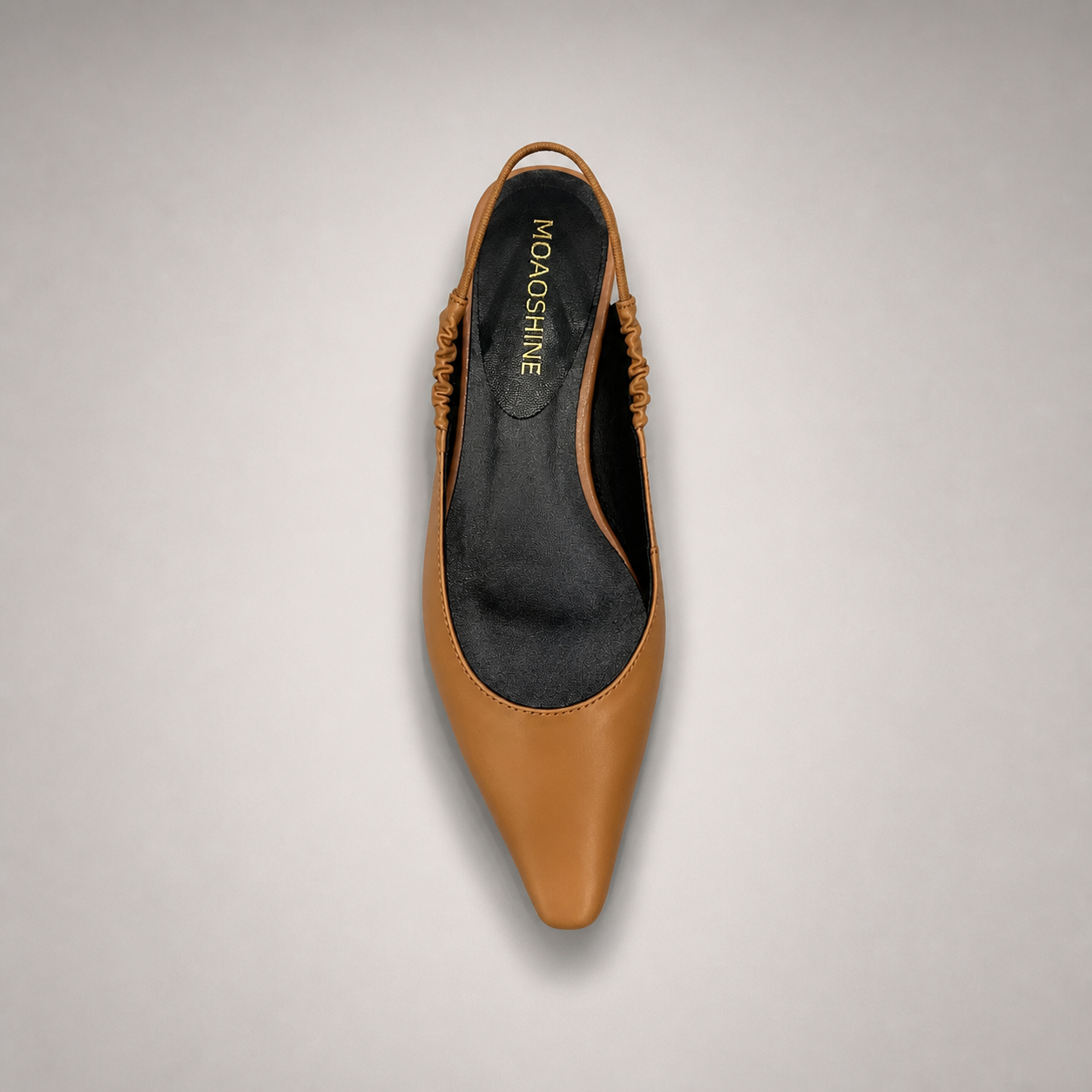 Tan slingback flat outsole view showing the cow leather outsole