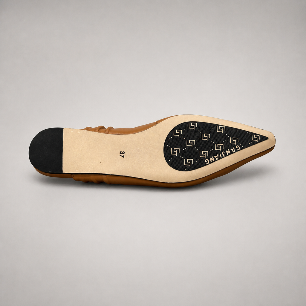 Tan slingback flat top view showing a square toe and gathered slingback strap