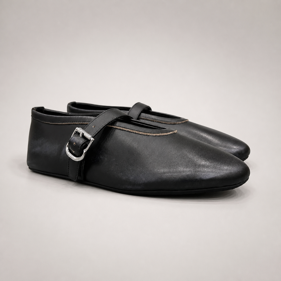 Black buckle-strap flat pair three-quarter view