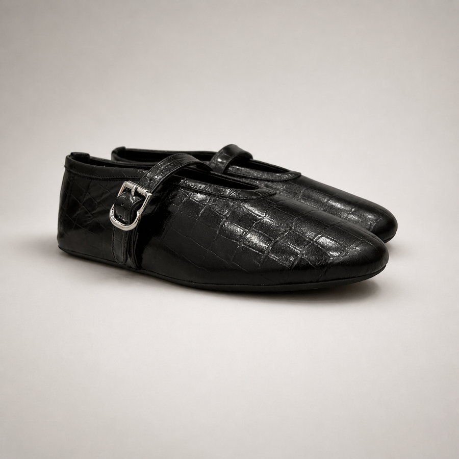 Black buckle-strap flat pair three-quarter view