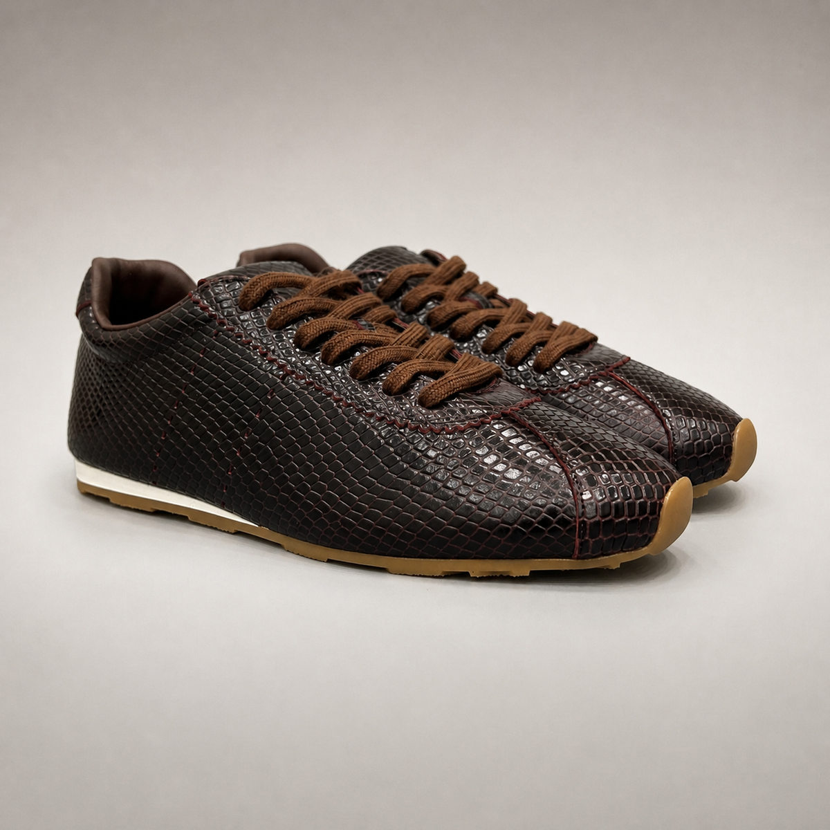 Burgundy Brown low-profile lace-up sneaker pair three-quarter view