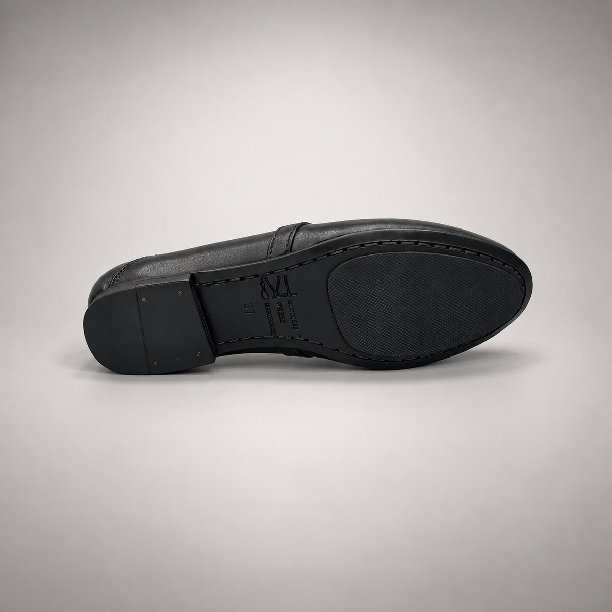 Black washed leather horsebit loafer outsole view