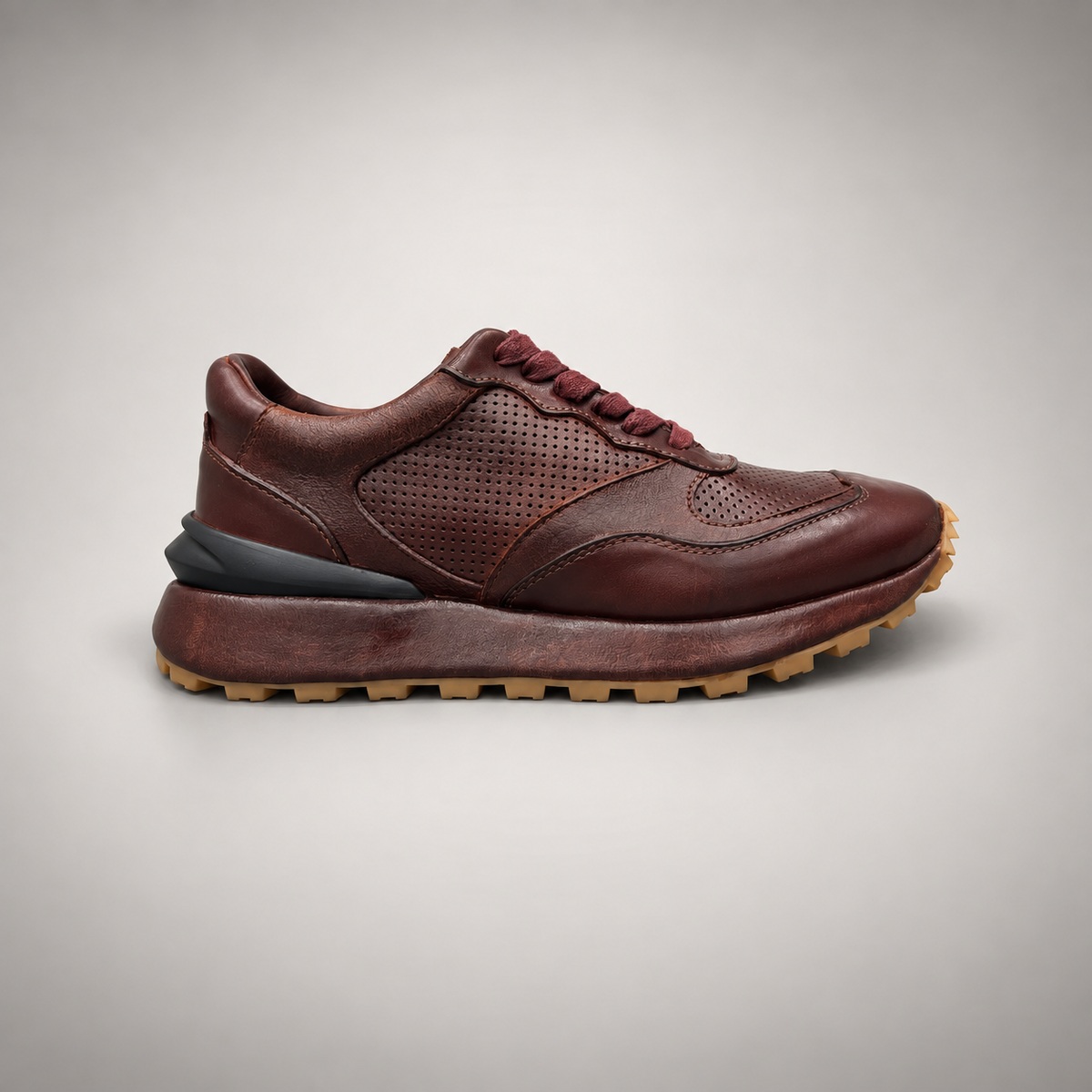 Dark brown perforated leather platform sneaker side view