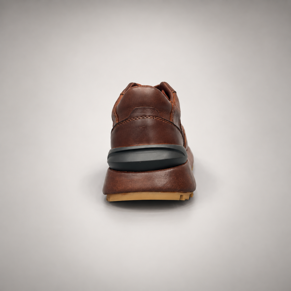 Dark brown perforated leather platform sneaker rear view