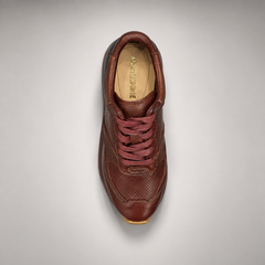 Dark brown perforated leather platform sneaker top view