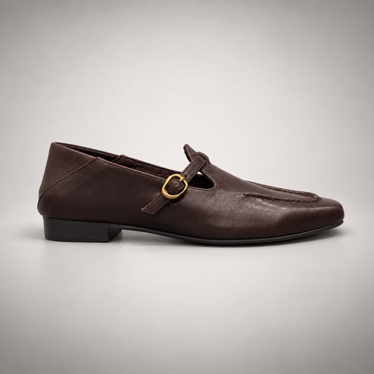 Dark brown leather buckle-strap shoe side view