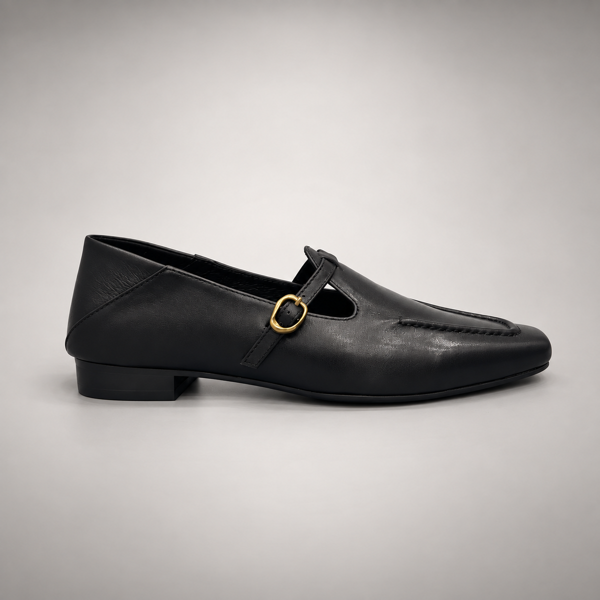 Black leather buckle-strap shoe side view