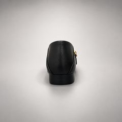 Black leather buckle-strap shoe rear view