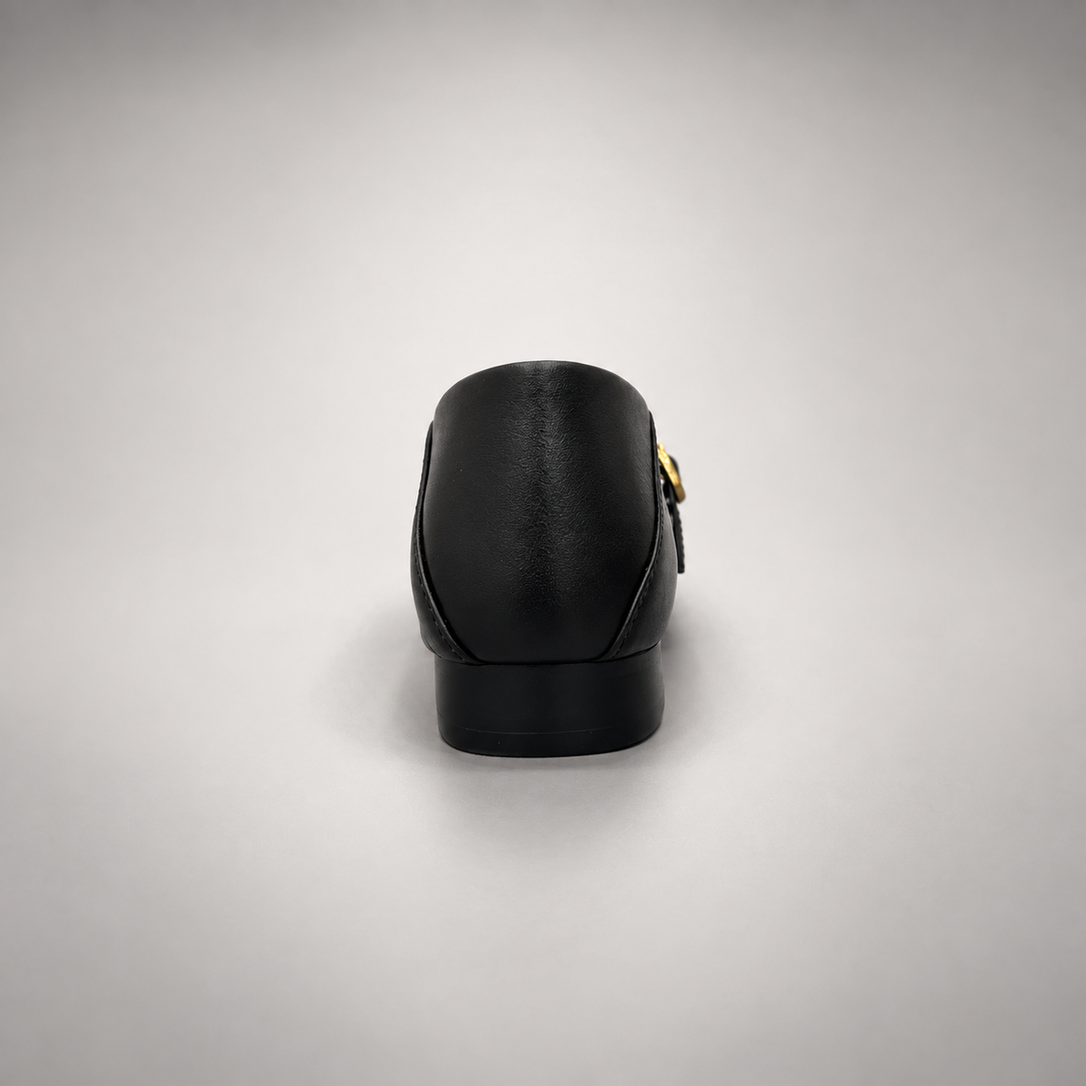 Black leather buckle-strap shoe rear view