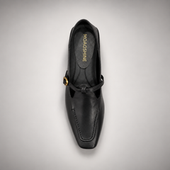 Black leather buckle-strap shoe top view