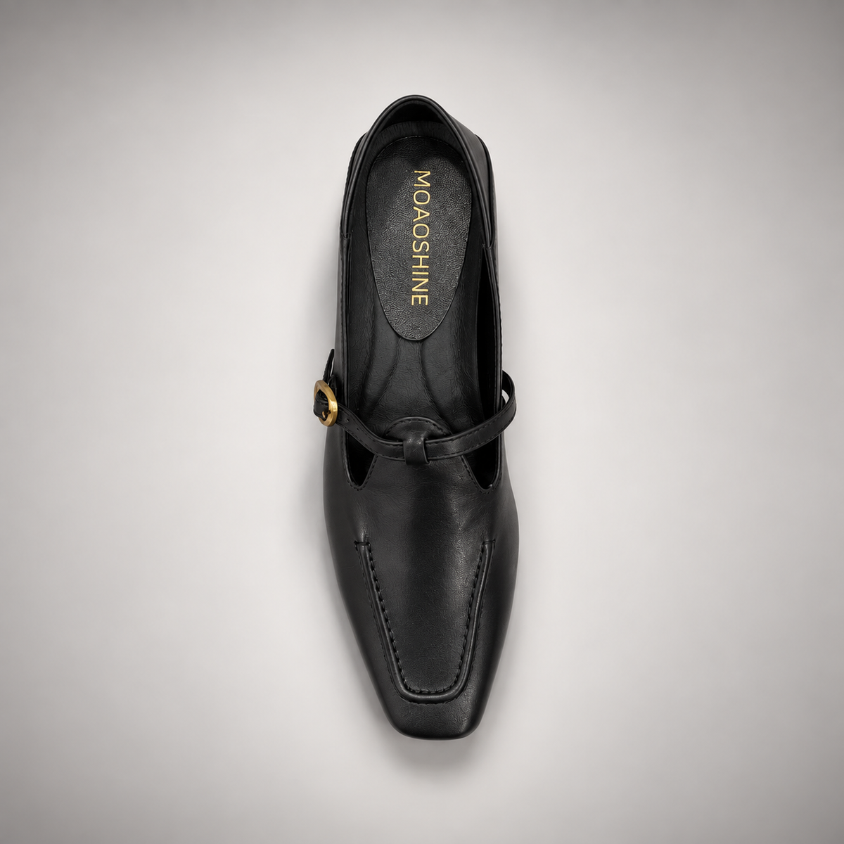 Black leather buckle-strap shoe top view