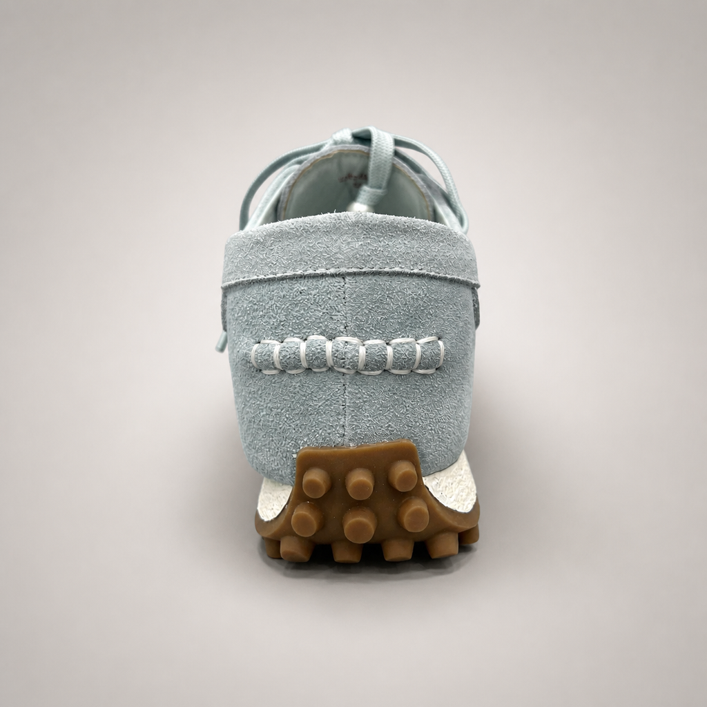 Light Blue moccasin sneaker rear view showing fringe and tassel details over the laces