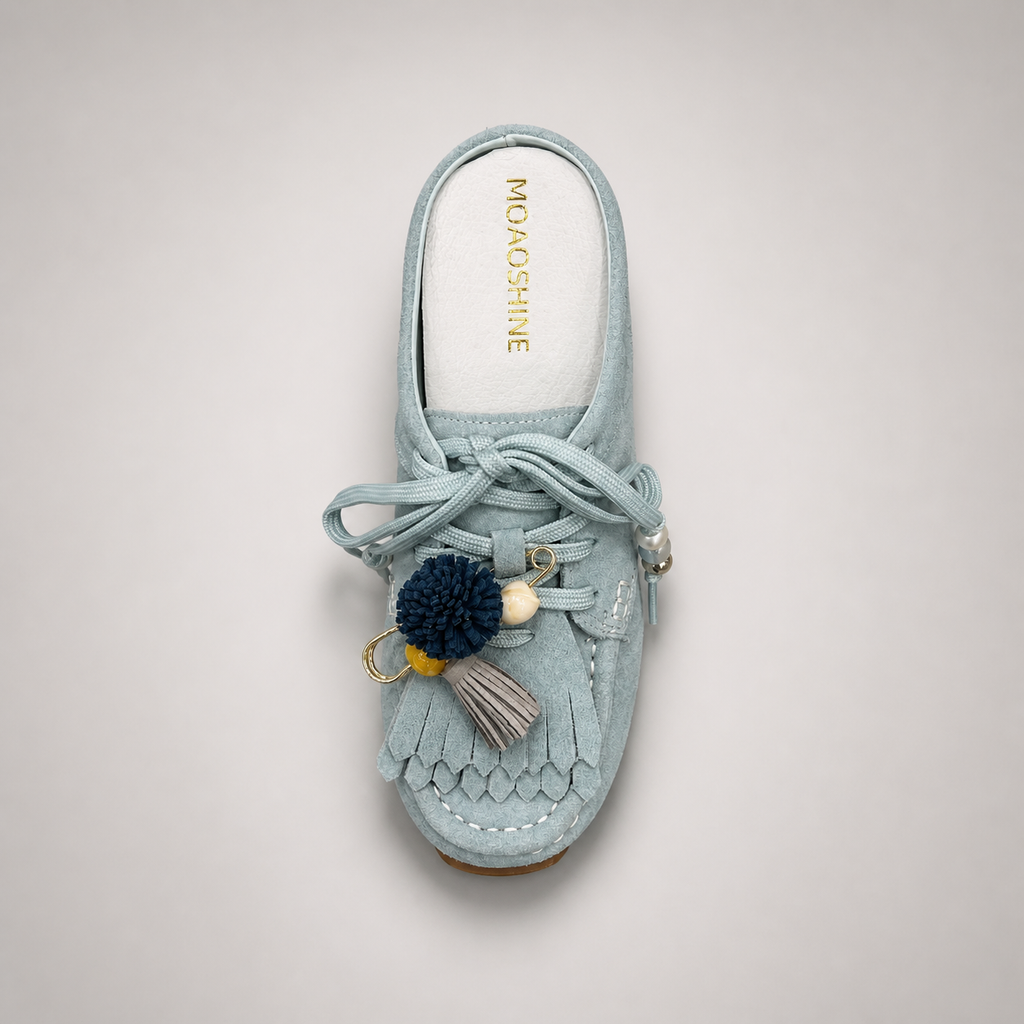 Light Blue moccasin sneaker top view showing fringe and tassel details over the laces