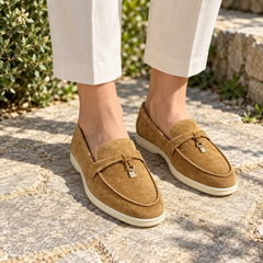 Tan Sheep Suede Metal-Accent Loafers worn outdoors