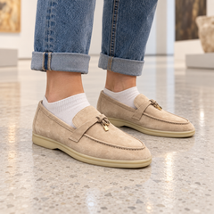 Beige Sheep Suede Metal-Accent Loafers worn outdoors
