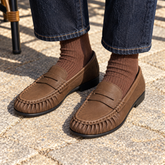Brown Top-Grain Cow Leather Ruched Penny Loafers on foot