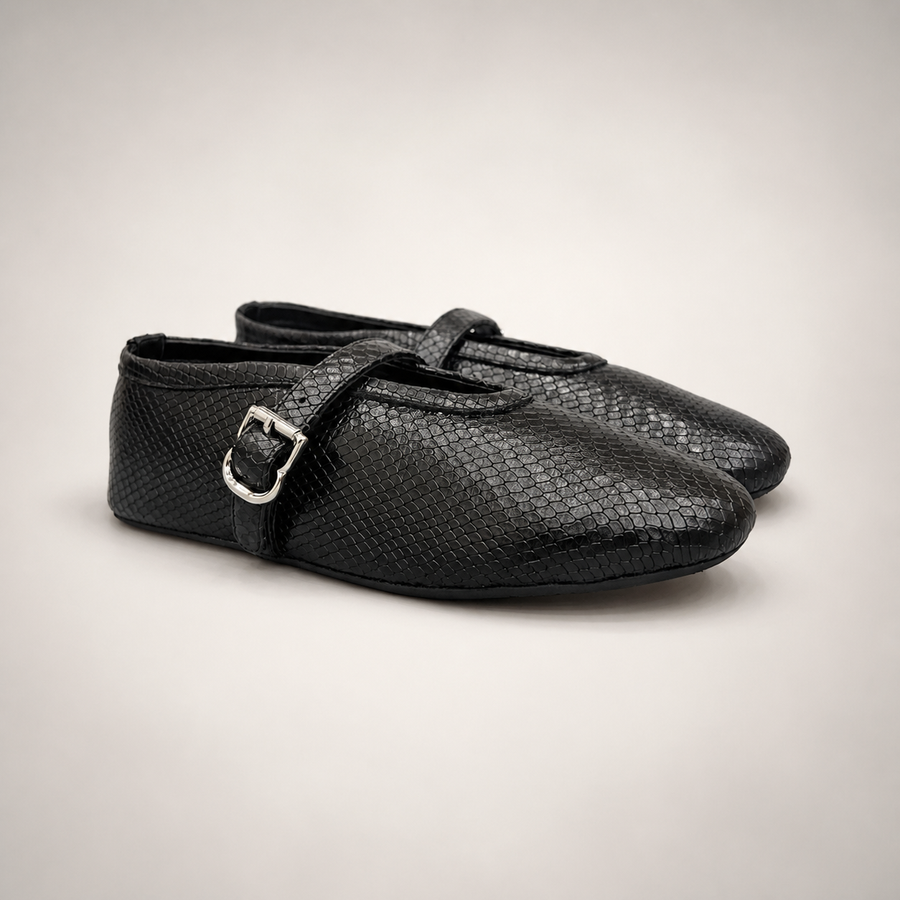 Black snake-embossed buckle-strap flat pair three-quarter view