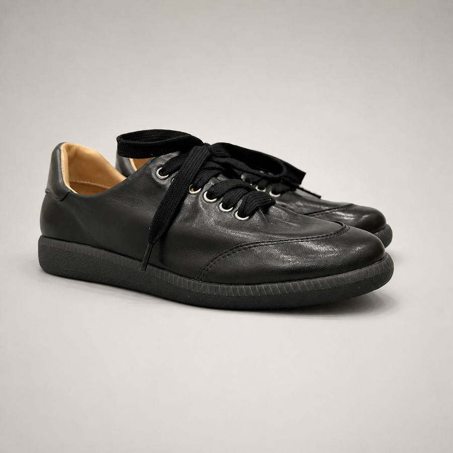 Black Sneakers pair three-quarter view
