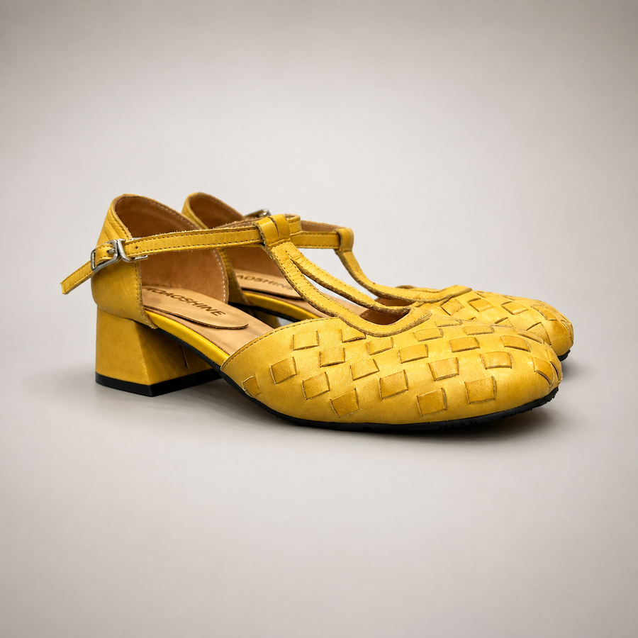 Yellow Pumps pair three-quarter view