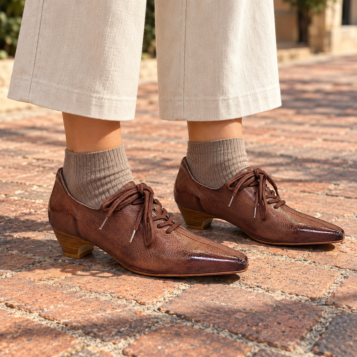 Brown Horse Leather Pointed-Toe Lace-Up Oxfords on foot