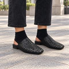 Black Horse Leather Woven Pointed-Toe Mules on foot