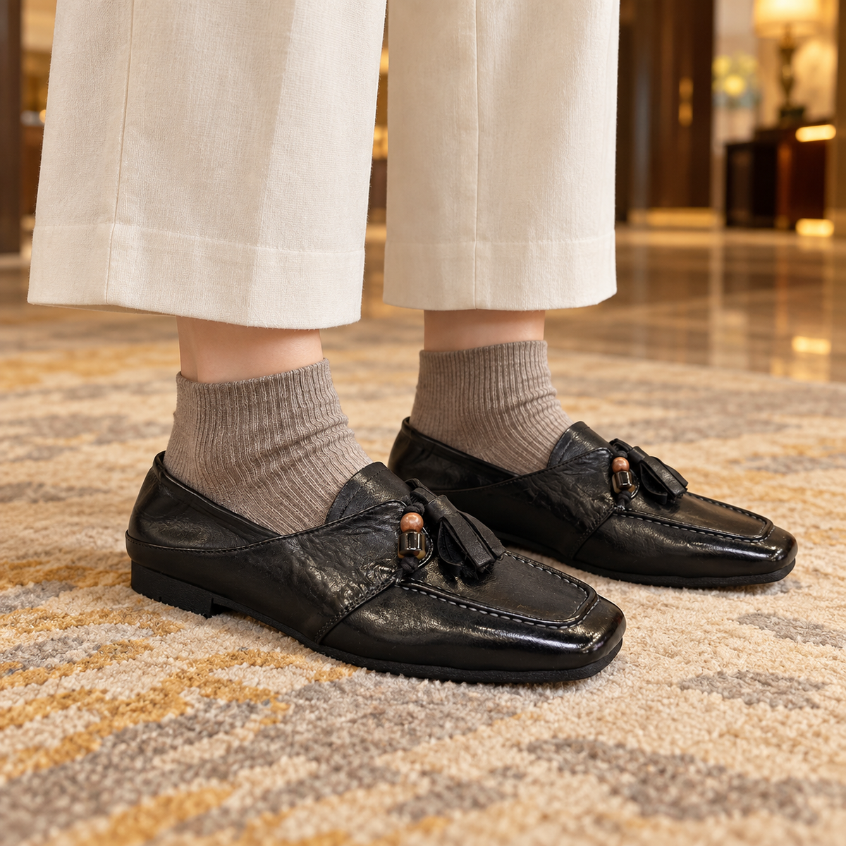 Black Horse Leather Tassel Loafers on foot