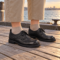 Black Horse Leather Woven-Panel Lug-Sole Derby Shoes on foot