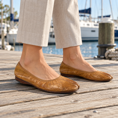 Tan flats worn on feet