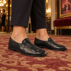 Black shoes worn on feet