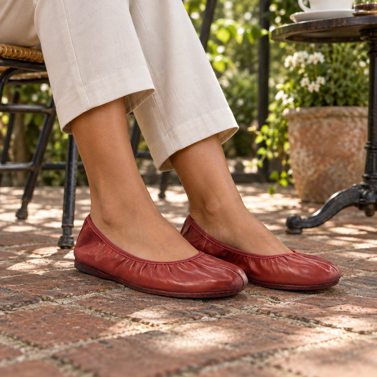 Red ballet flats worn on feet