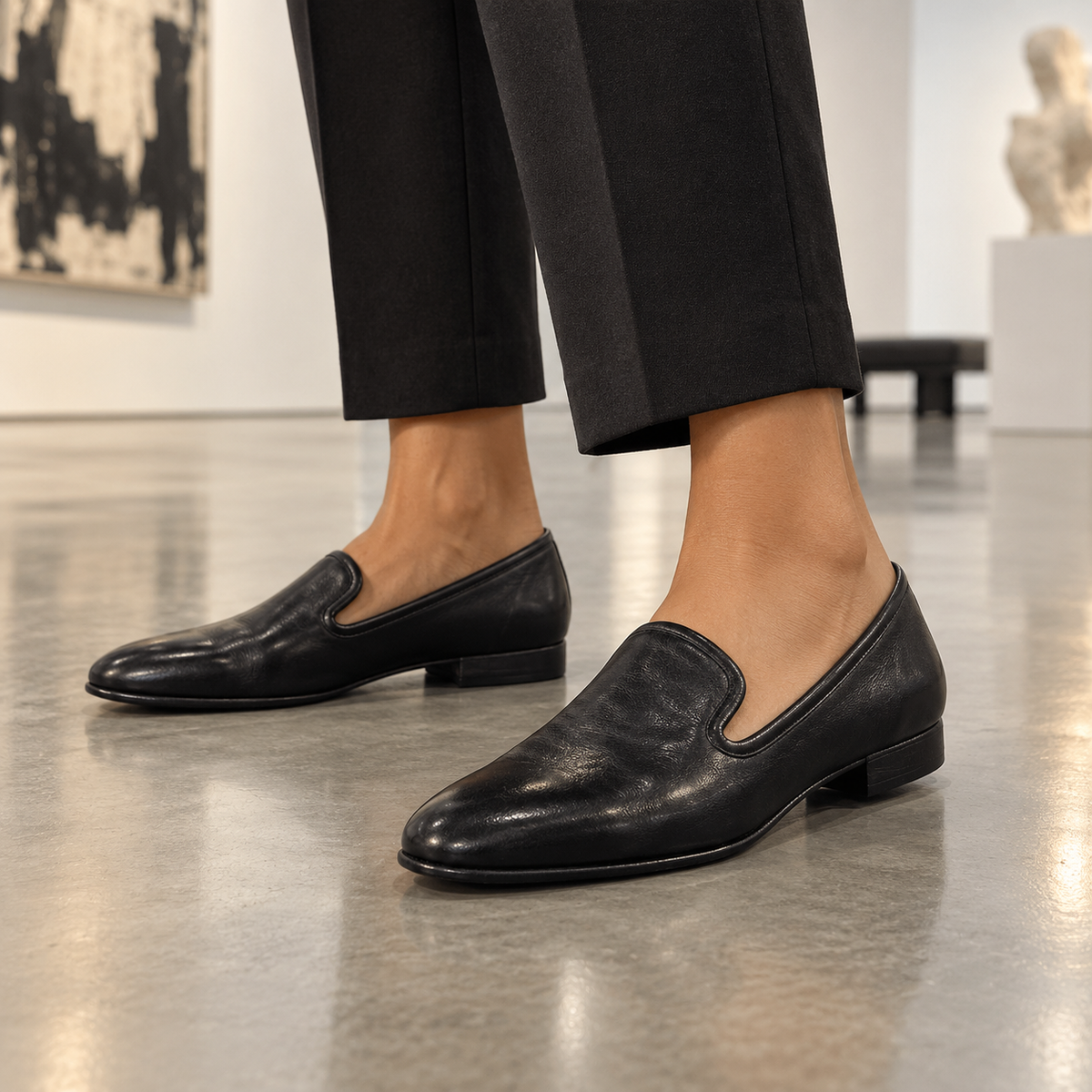 Black shoes worn on feet
