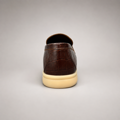 Brown loafer outsole view showing the rubber outsole