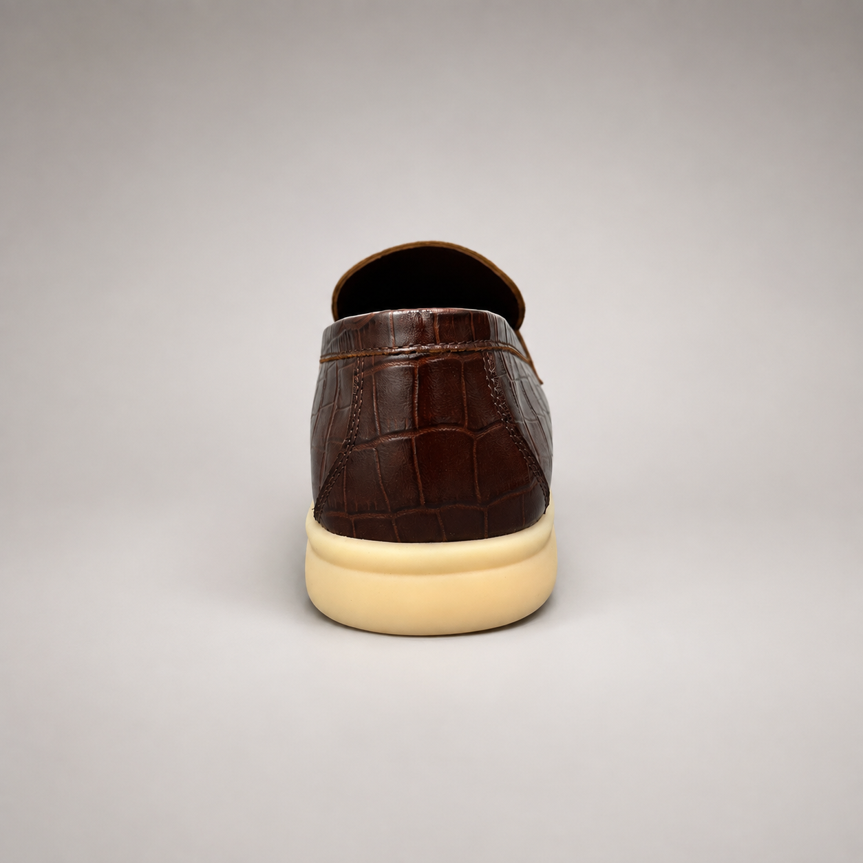 Brown loafer outsole view showing the rubber outsole