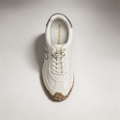Silver sneaker top view showing a panelled lace-up upper