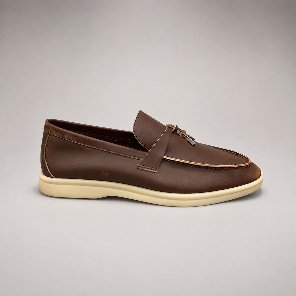 Brown loafer opposite side profile showing a metal accent across the vamp