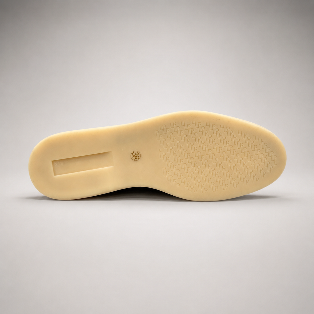 Brown loafer outsole view showing the rubber outsole