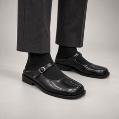 Black Patent Leather Split-Toe Mary Jane Mules worn on foot