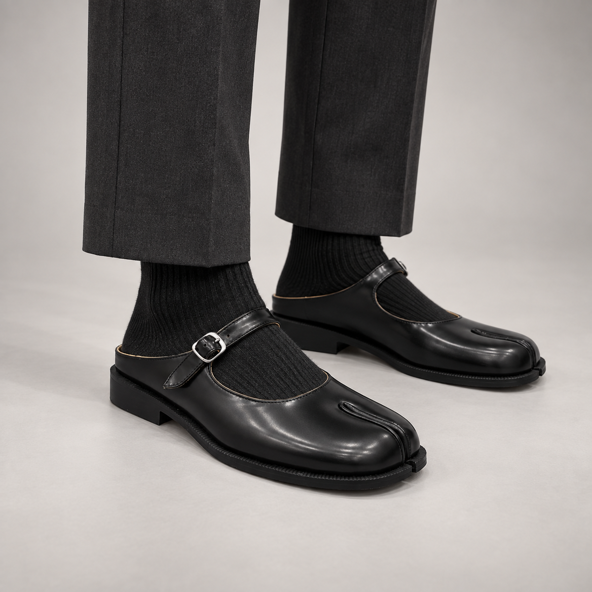 Black Patent Leather Split-Toe Mary Jane Mules worn on foot