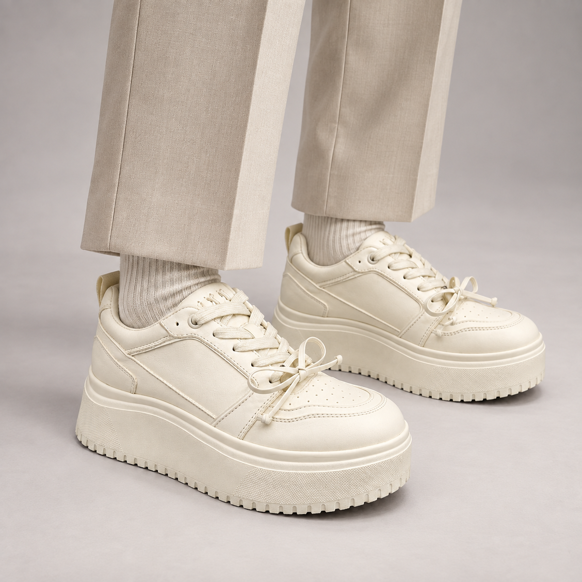 White Leather Chunky Platform Sneakers worn on foot