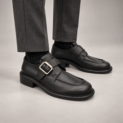 Black Leather Oversized-Buckle Moc-Toe Shoes worn on foot